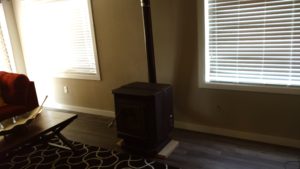 Monkey Island Gray Cabin - Wood stove in livingroom